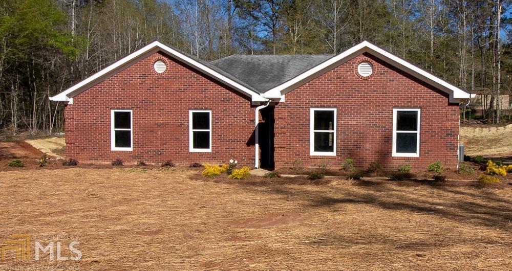 165 Springdale Road Jackson, GA 30233 - Photo 1 of 1 a front view of a house with a yard