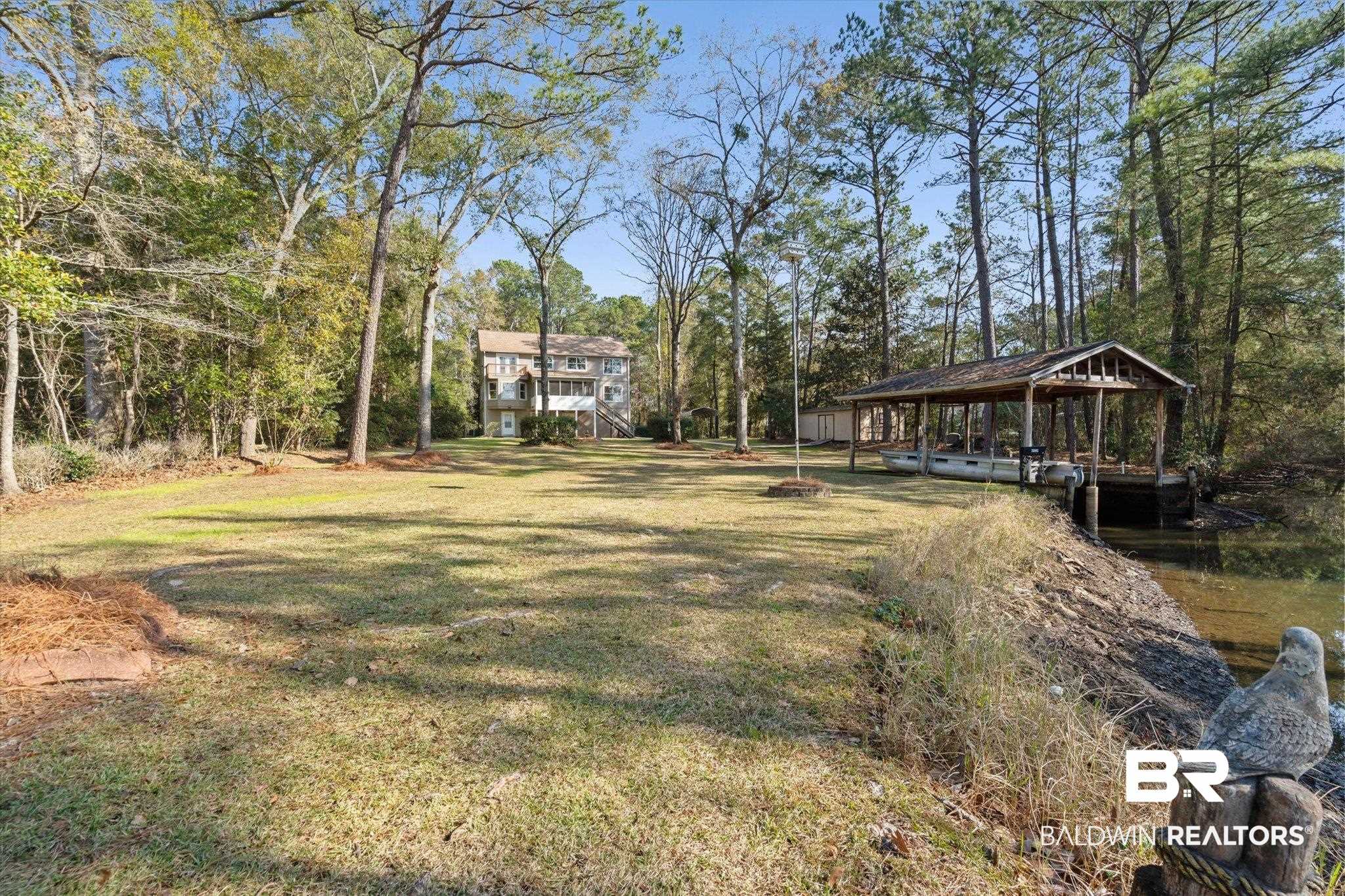 3847 Riviere Du Chien Road Mobile, AL 36693 - Photo 33 of 51 View of grassy yard featuring view of scattered trees and a water view