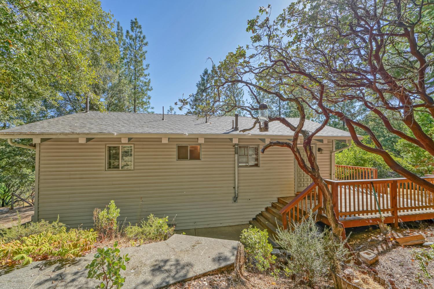 6426 Sly Park Road Placerville, CA 95667 - Photo 1 of 32 a side view of a house with a yard