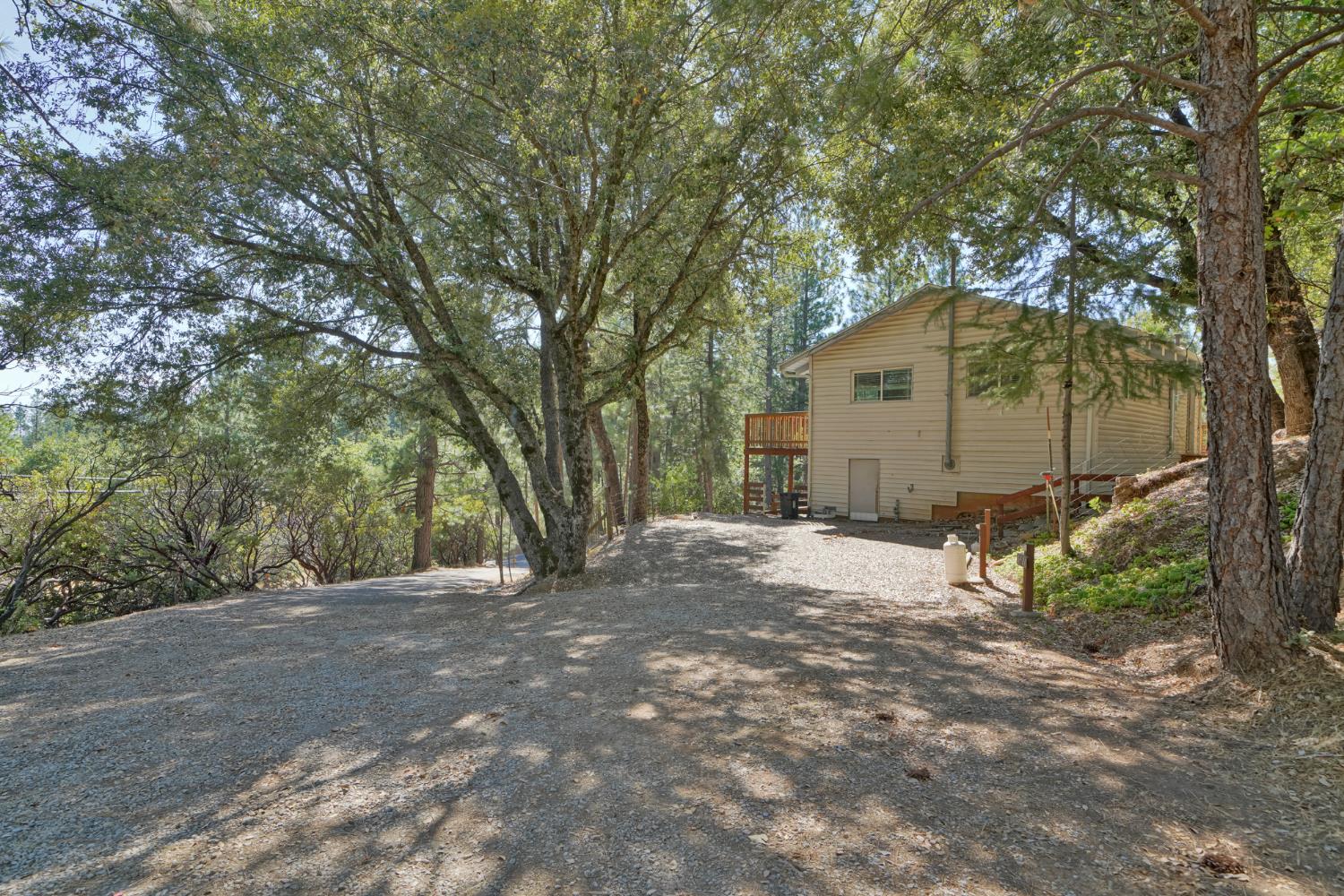 6426 Sly Park Road Placerville, CA 95667 - Photo 24 of 32 a view of a house with a trees