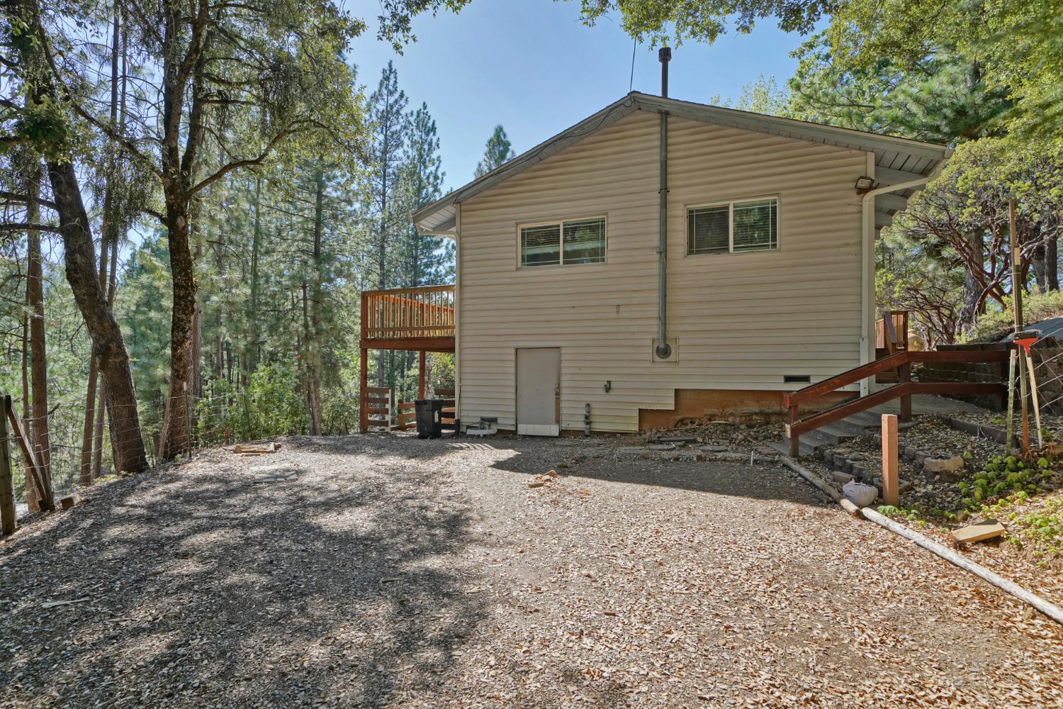 6426 Sly Park Road Placerville, CA 95667 - Photo 25 of 32 a backyard of a house with table and chairs