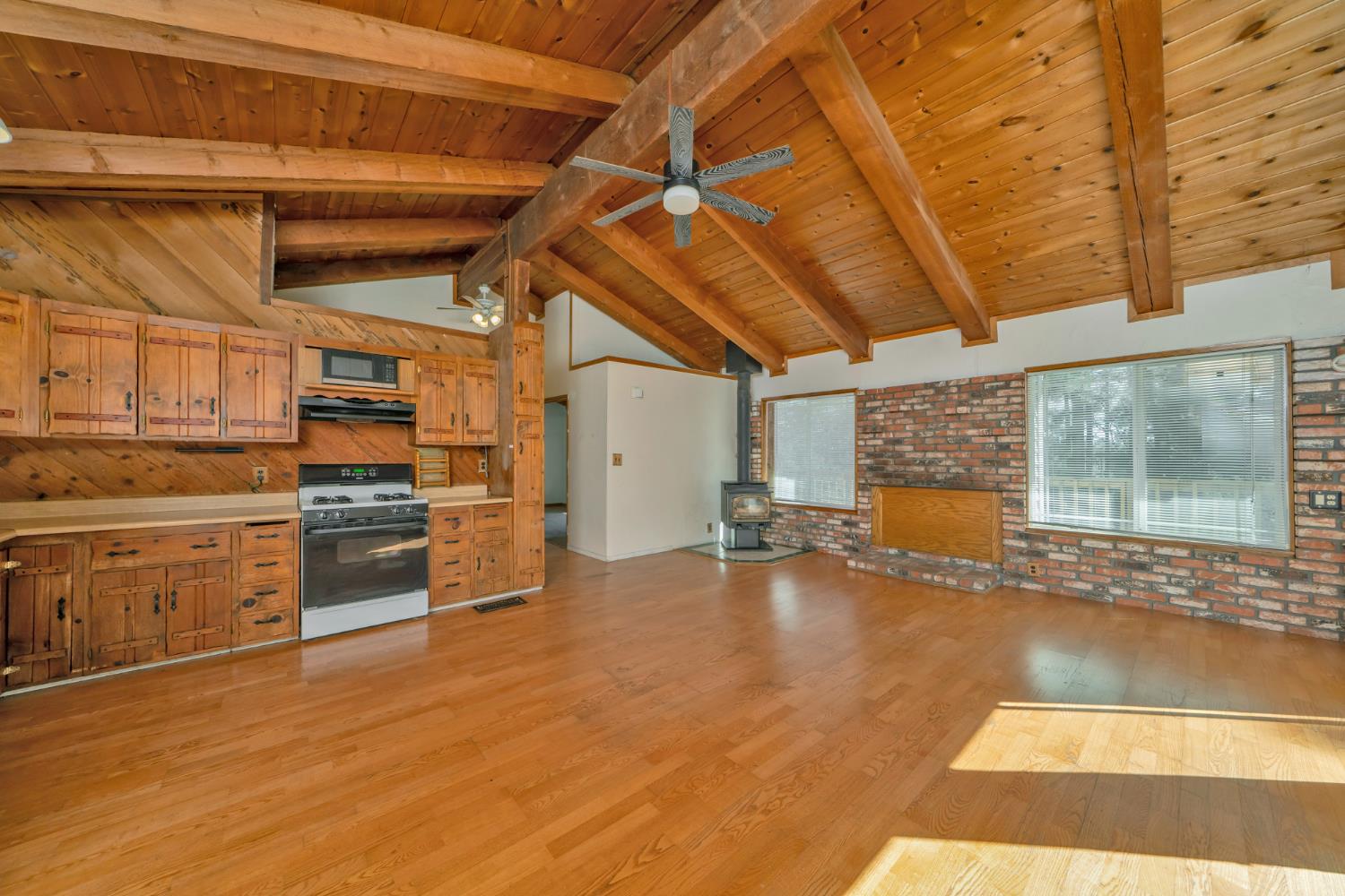 6426 Sly Park Road Placerville, CA 95667 - Photo 9 of 32 a view of a kitchen with a sink and a stove top oven