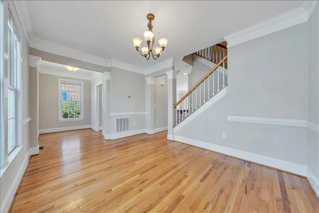a view of an entryway with wooden floor