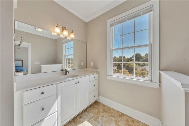 a spacious bathroom with a double vanity sink and a mirror