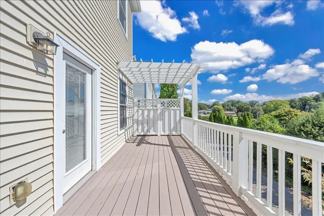 a view of a balcony with wooden floor