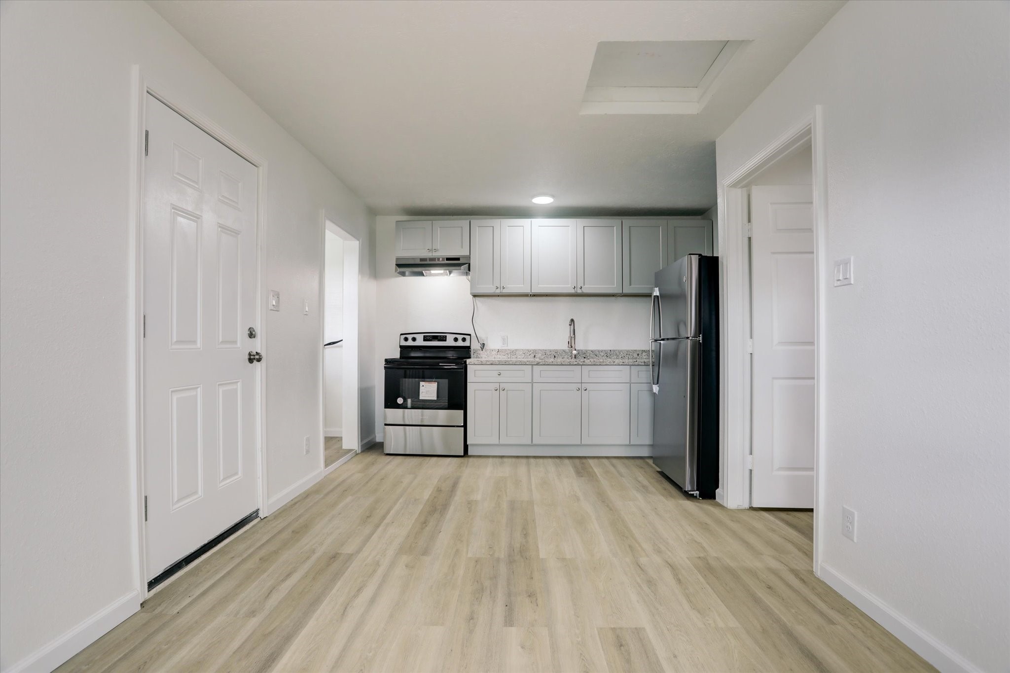5806 Highway 35 Angleton, TX 77515 - Photo 19 of 35 The guest house comes with stainless appliances, laminate flooring and a fridge.