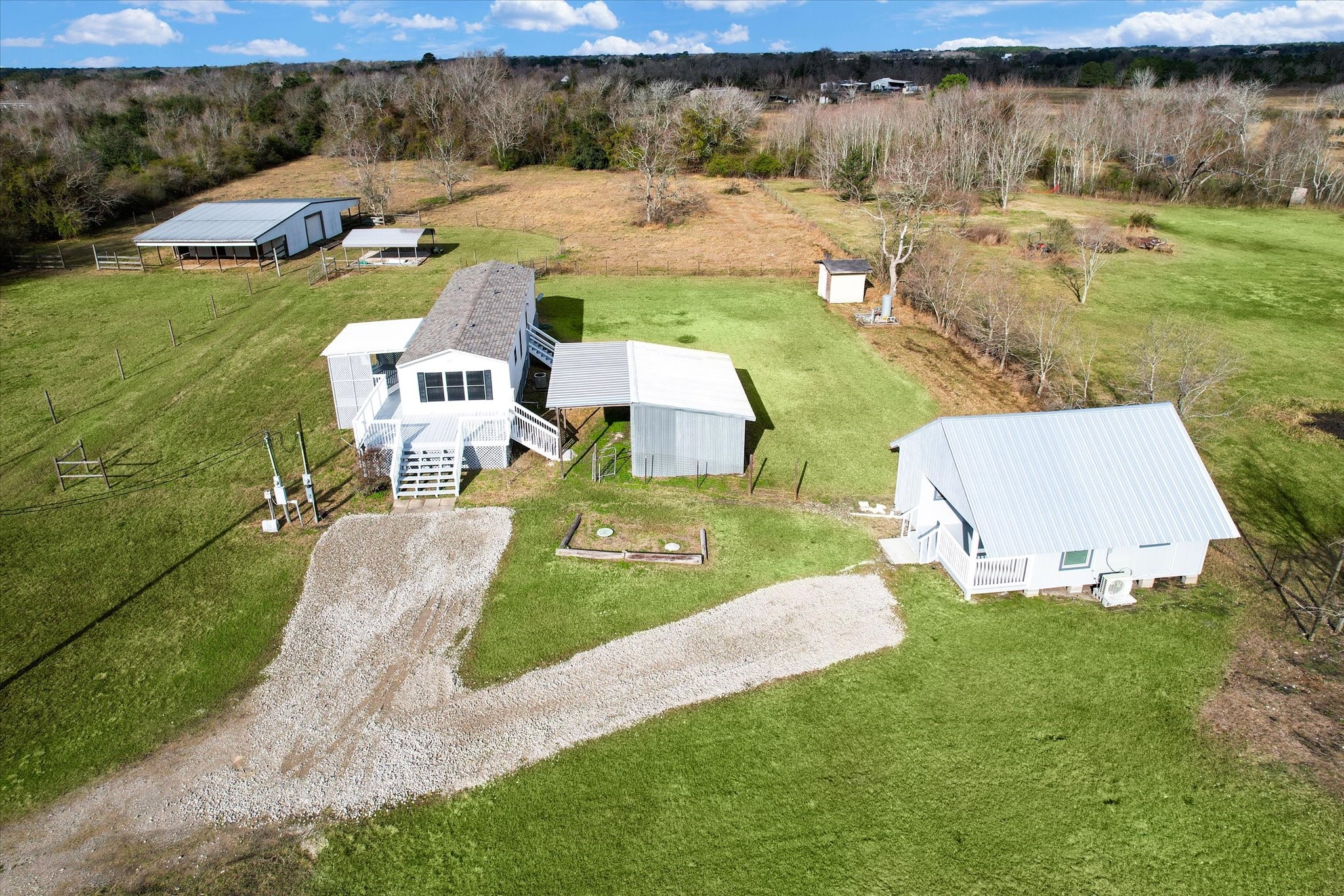 5806 Highway 35 Angleton, TX 77515 - Photo 2 of 35 From Left to right. In the back there is a barn with able storage space and stalls, a covered parking area, the main house, a storage shed, in the far back right of the property you have the well house, and on the bottom right of the property is the amazing guest house. (Currently rented out)