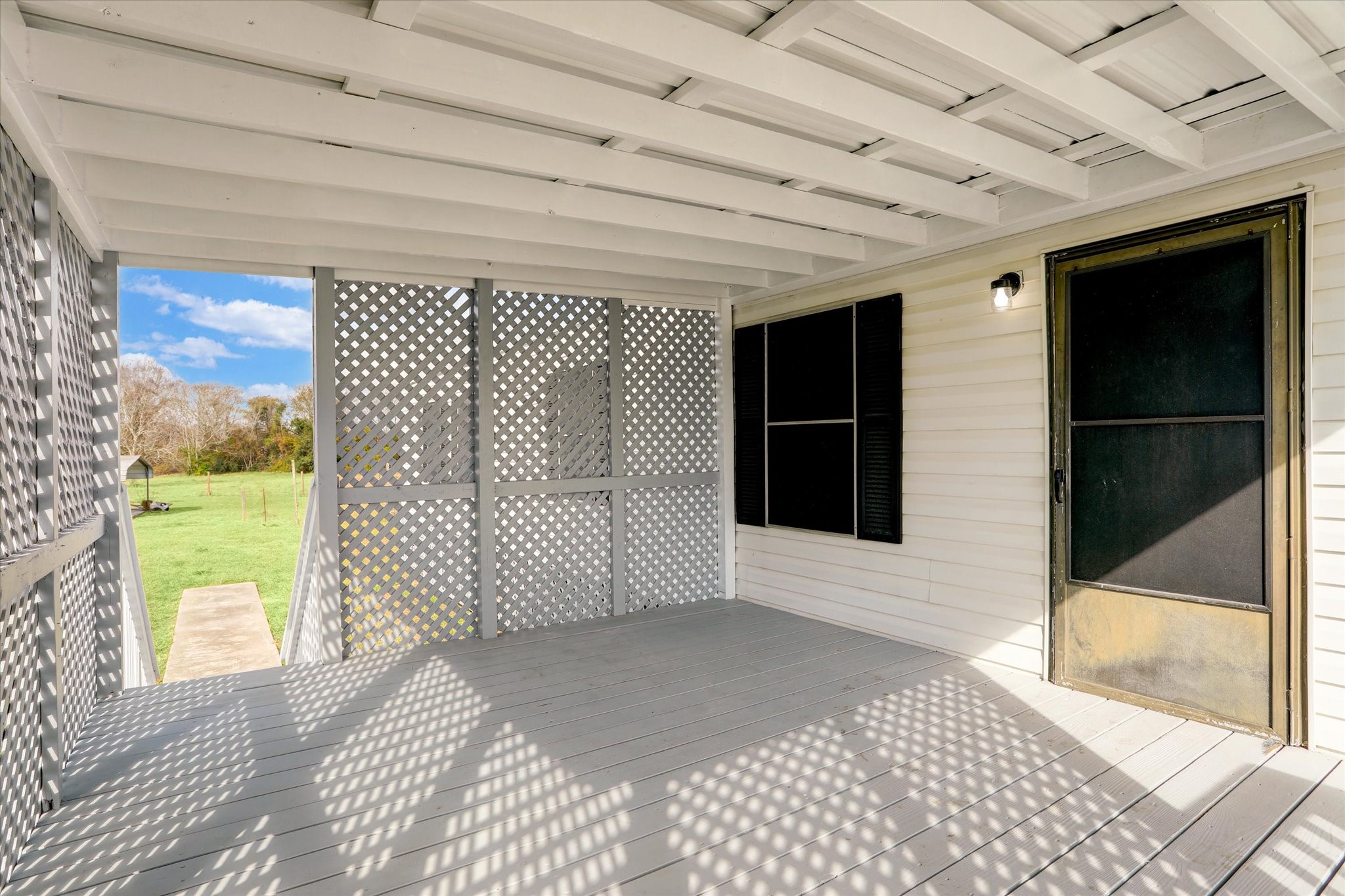 5806 Highway 35 Angleton, TX 77515 - Photo 5 of 35 This covered porch offers shade and plenty of privacy.