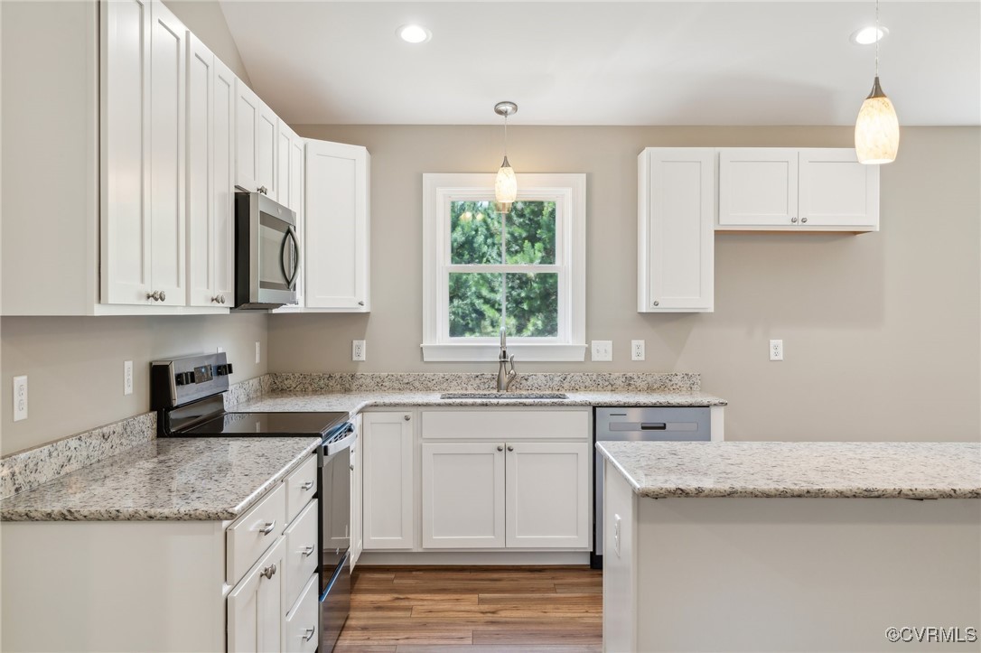 520 Salem Church Road Cumberland, VA 23040 - Photo 13 of 36 a kitchen with stainless steel appliances granite countertop a sink stove and cabinets