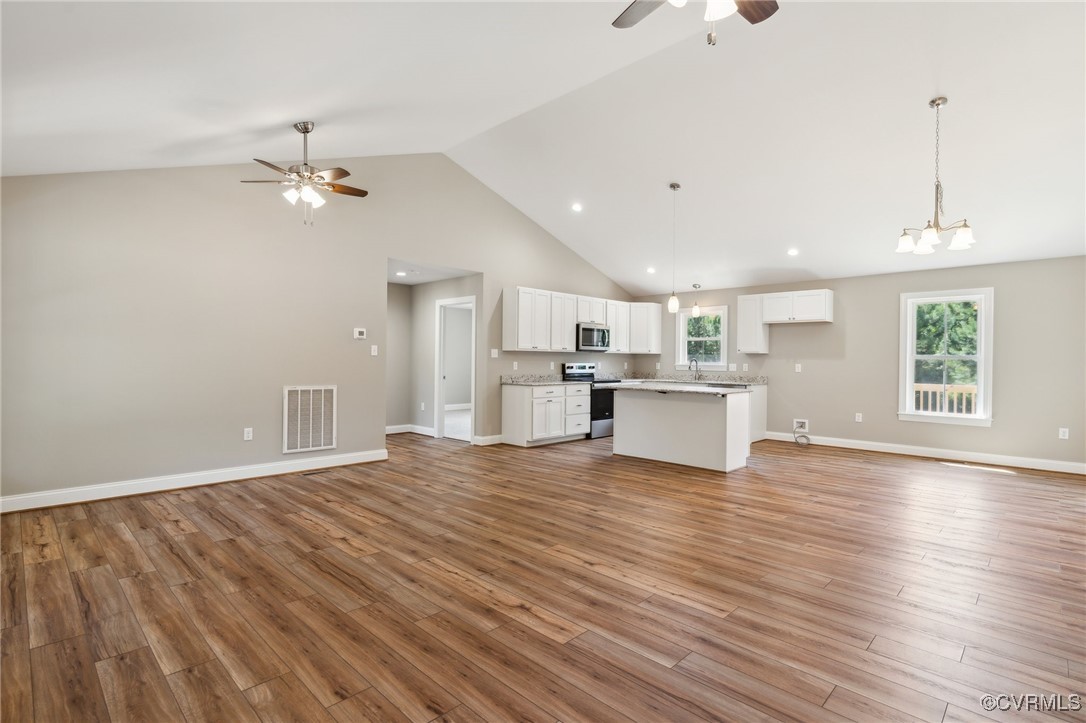 520 Salem Church Road Cumberland, VA 23040 - Photo 6 of 36 a view of a kitchen with wooden floor and a kitchen space