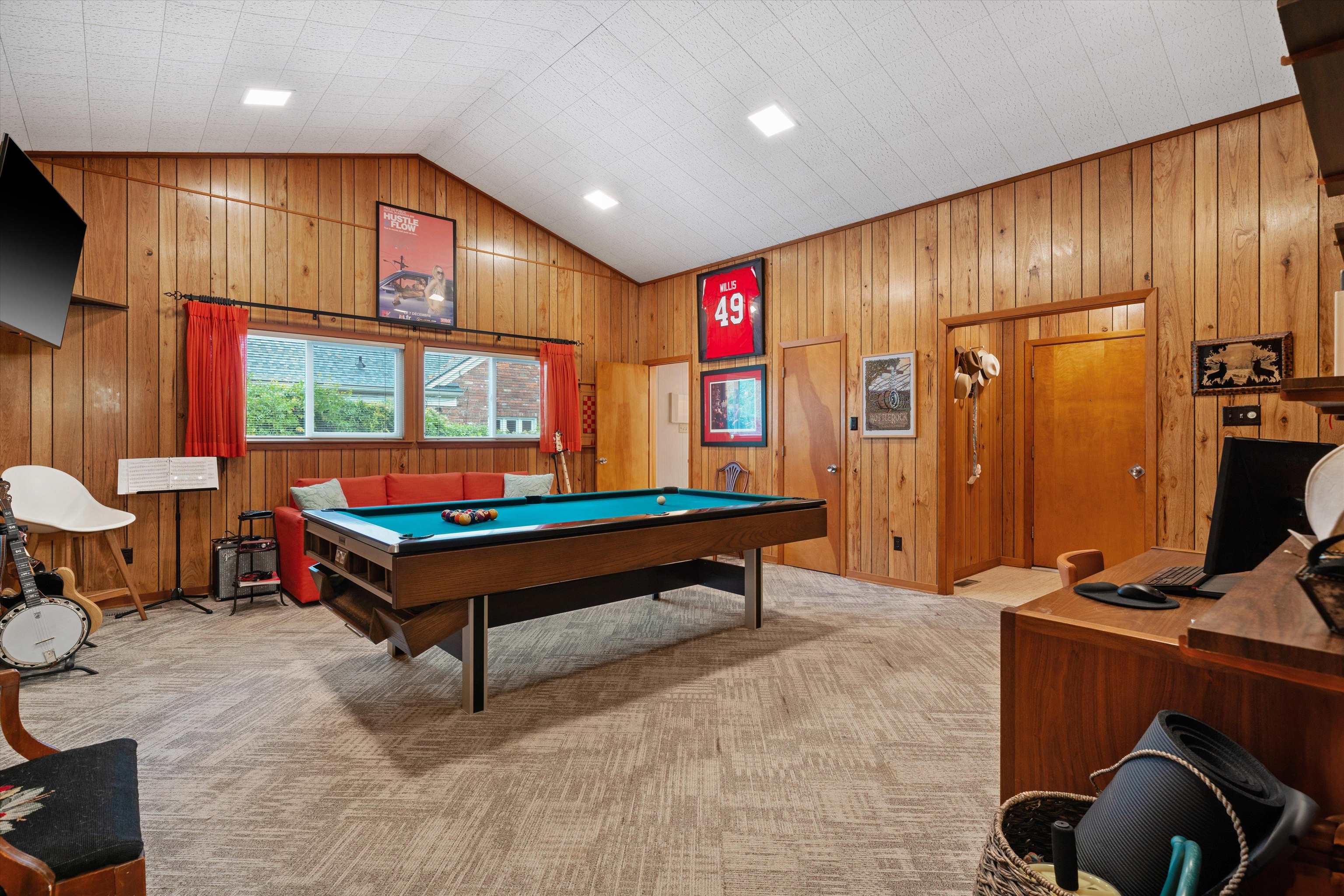 180 South Grove Park Road Memphis, TN 38117 - Photo 20 of 39 a living room with furniture a pool table and a flat screen tv