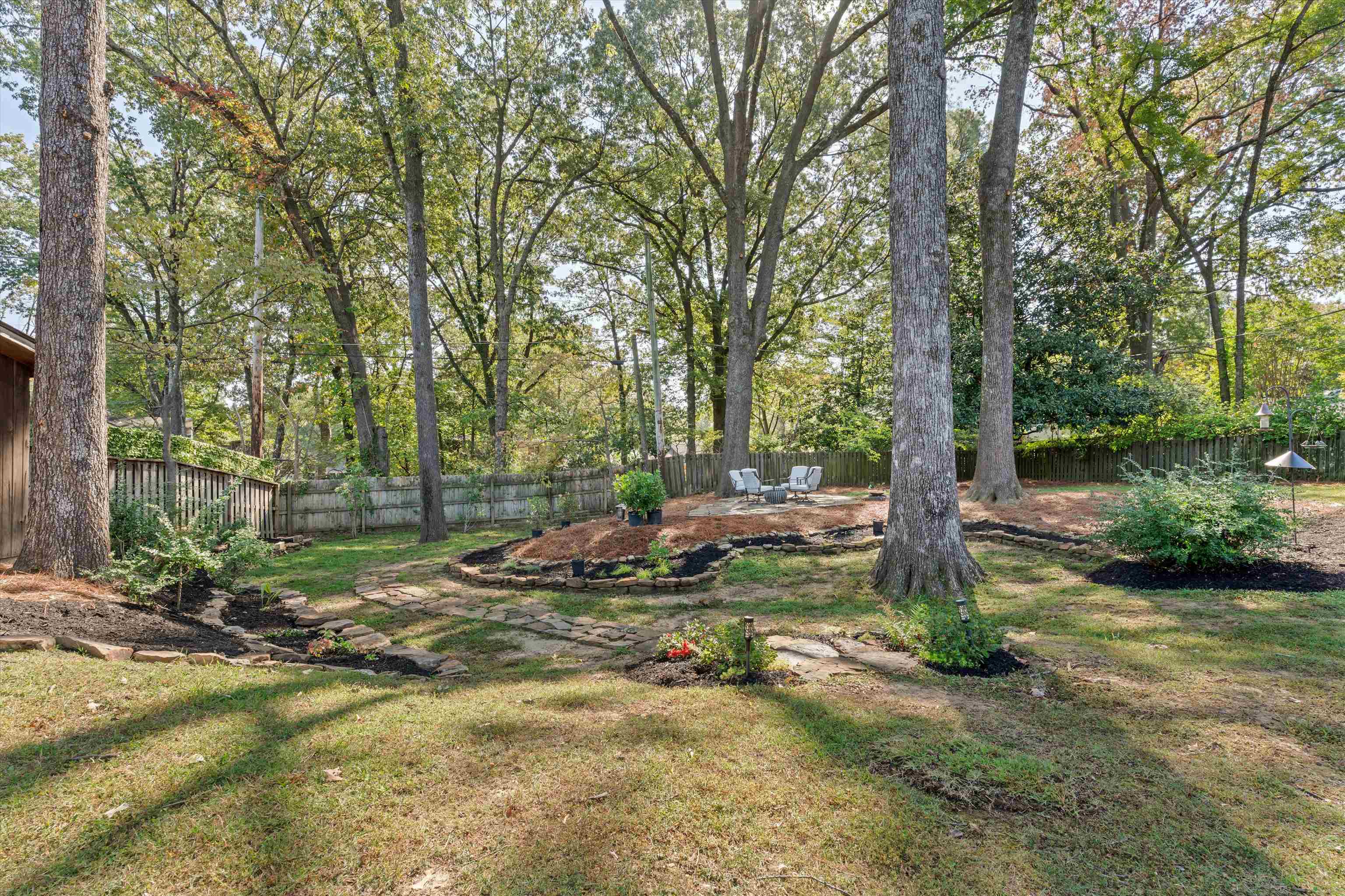 180 South Grove Park Road Memphis, TN 38117 - Photo 32 of 39 a backyard of a house with a yard and outdoor seating