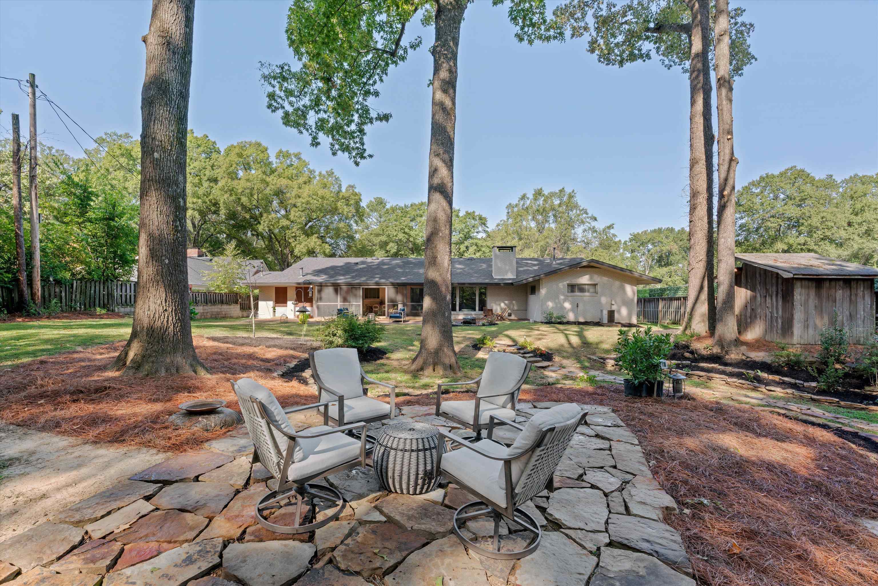 180 South Grove Park Road Memphis, TN 38117 - Photo 34 of 39 a view of a patio with table and chairs potted plants and palm tree