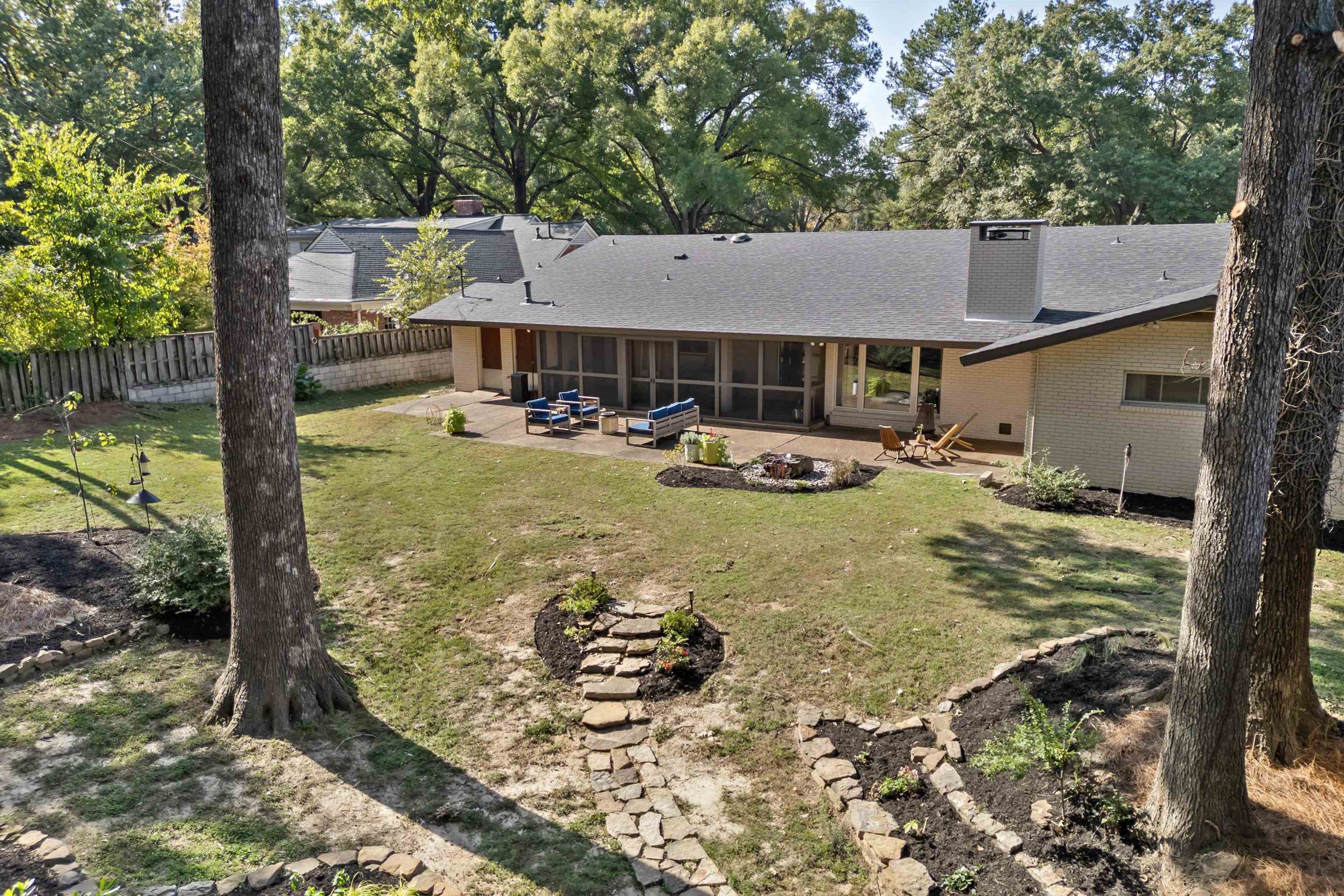 180 South Grove Park Road Memphis, TN 38117 - Photo 35 of 39 a view of a house with backyard porch and sitting area