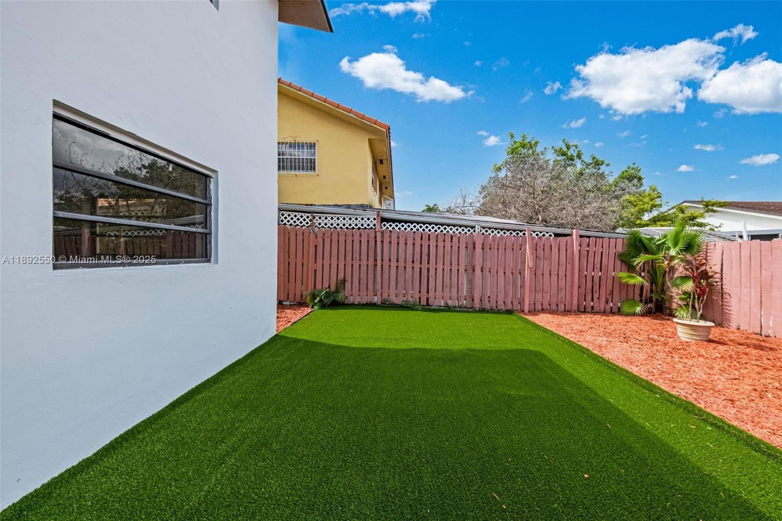 1283 West 42nd Street Hialeah, FL 33012 - Photo 19 of 54 a view of a backyard with a garden