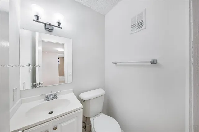 a spacious bathroom with a toilet
