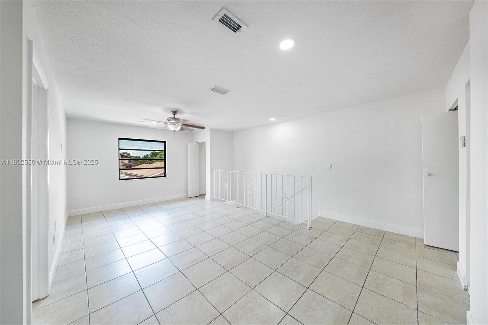 1283 West 42nd Street Hialeah, FL 33012 - Photo 37 of 54 an empty room with windows and fireplace