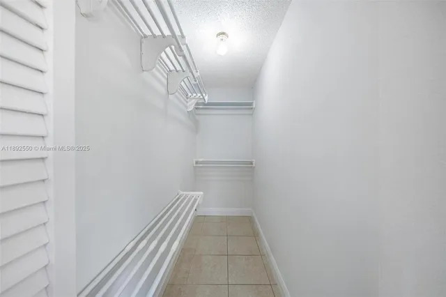 an aerial view of multiple houses with yard