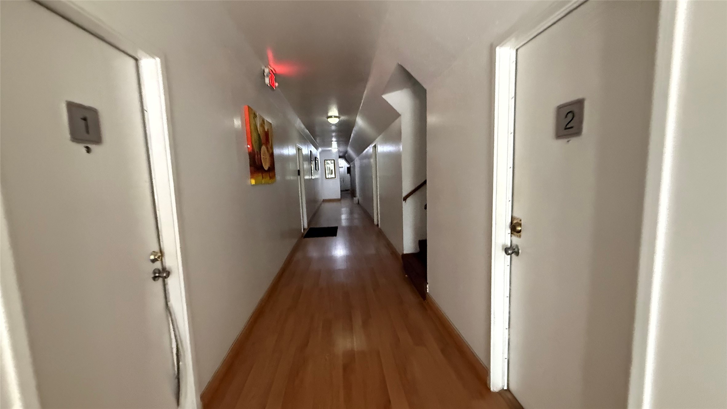 5611 Jackson Street, Unit 1 Houston, TX 77004 - Photo 5 of 5 a view of a hallway with wooden floor and entryway