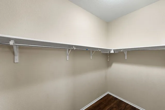 a view of a room with shelf on the wall