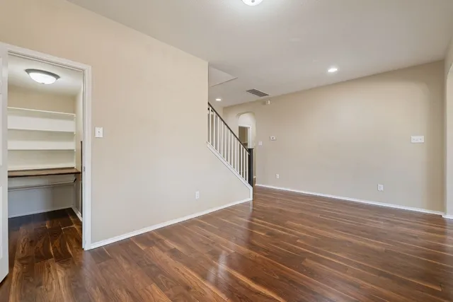 a view of an entryway with wooden floor