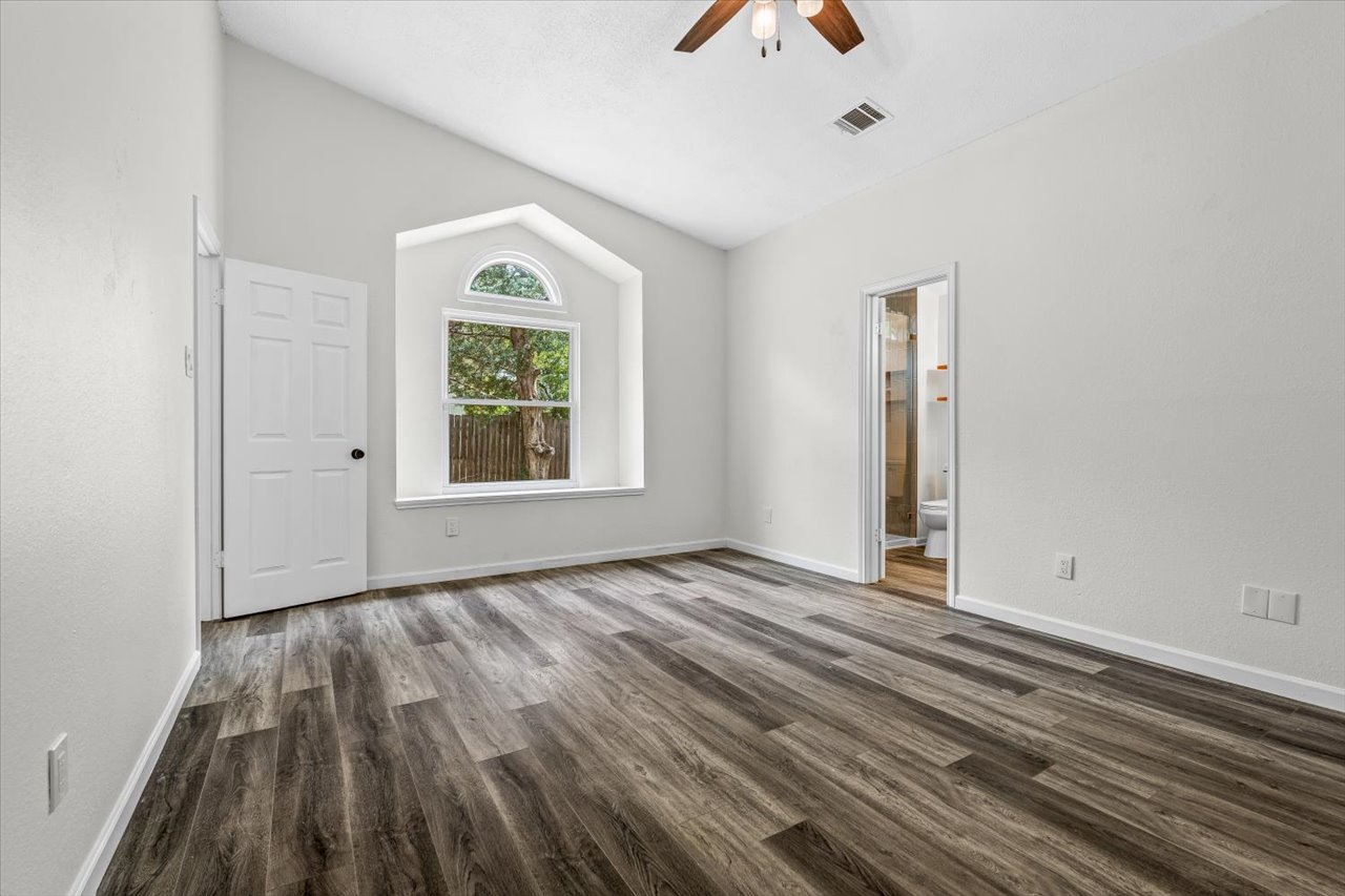 4004 Danli Lane Austin, TX 78749 - Photo 33 of 40 a view of an empty room with window and wooden floor