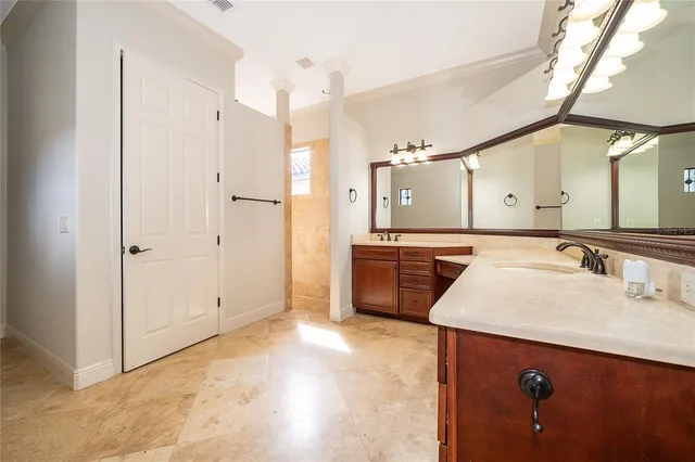 a bathroom with a sink a mirror and a shower