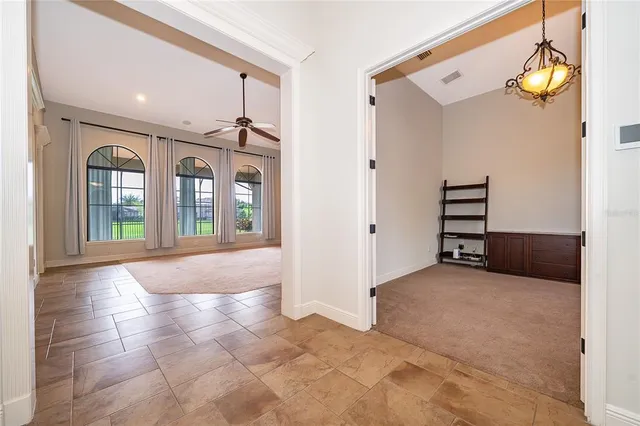 an empty room with windows and closet
