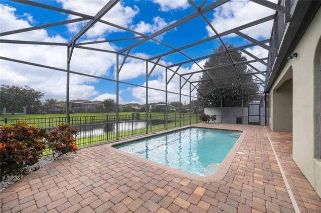 a view of swimming pool with a patio