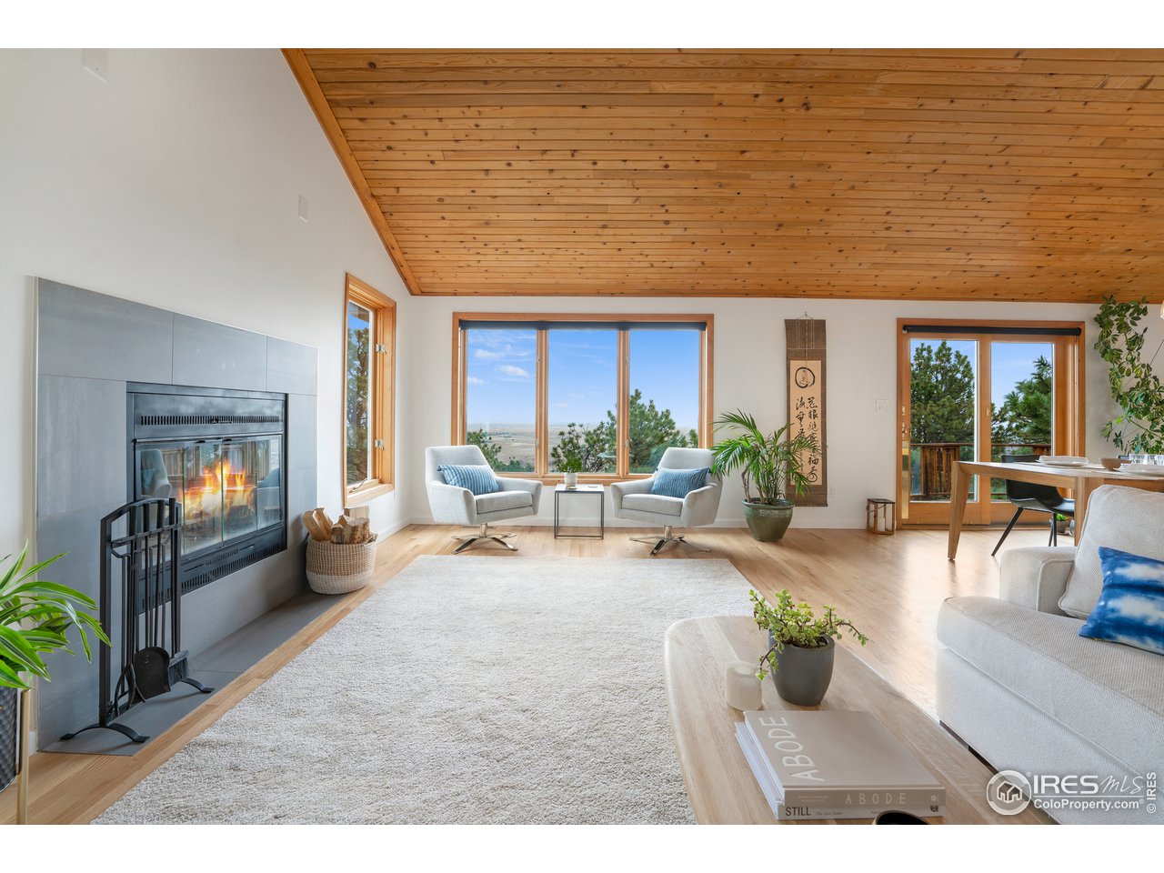 9042 Thunderhead Drive Boulder, CO 80302 - Photo 1 of 40 a living room with furniture floor to ceiling window and wooden floor