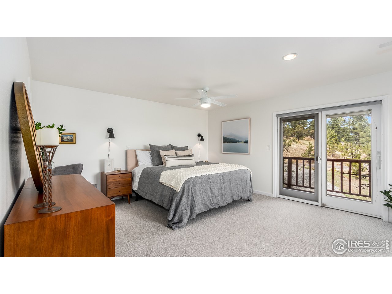 9042 Thunderhead Drive Boulder, CO 80302 - Photo 16 of 40 a living room with a bed furniture and a large window