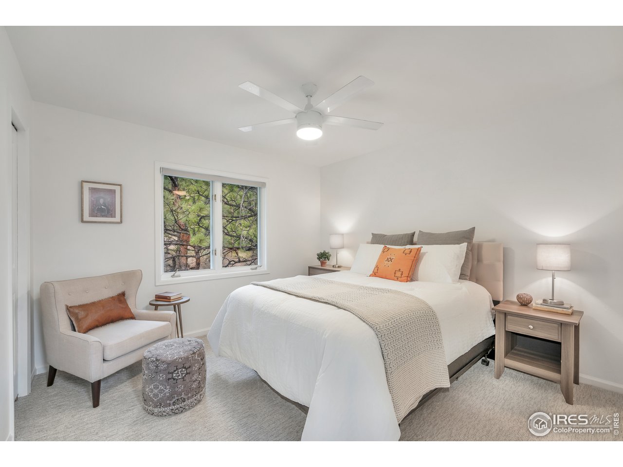 9042 Thunderhead Drive Boulder, CO 80302 - Photo 21 of 40 a bedroom with a bed and a large window