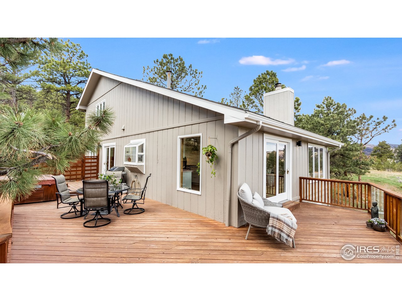9042 Thunderhead Drive Boulder, CO 80302 - Photo 29 of 40 a backyard of a house with table and chairs