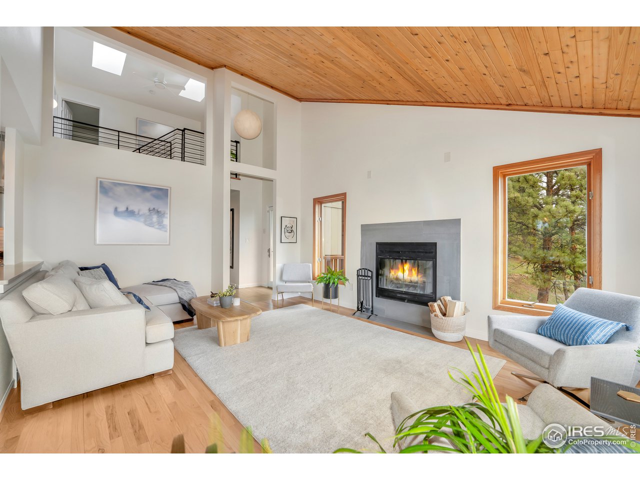 9042 Thunderhead Drive Boulder, CO 80302 - Photo 2 of 40 a living room with furniture and a fireplace