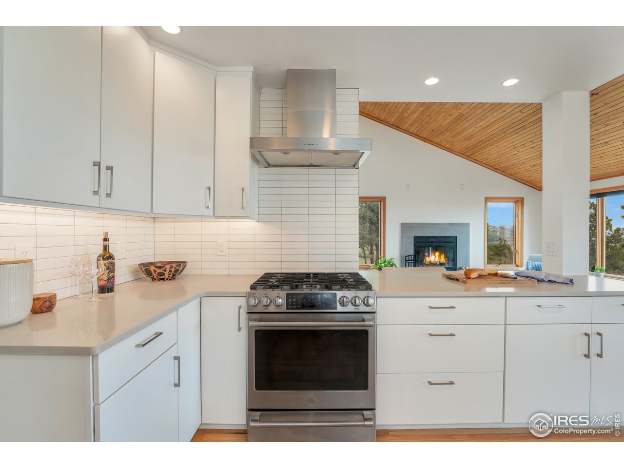 9042 Thunderhead Drive Boulder, CO 80302 - Photo 7 of 40 a kitchen with a stove and white cabinets