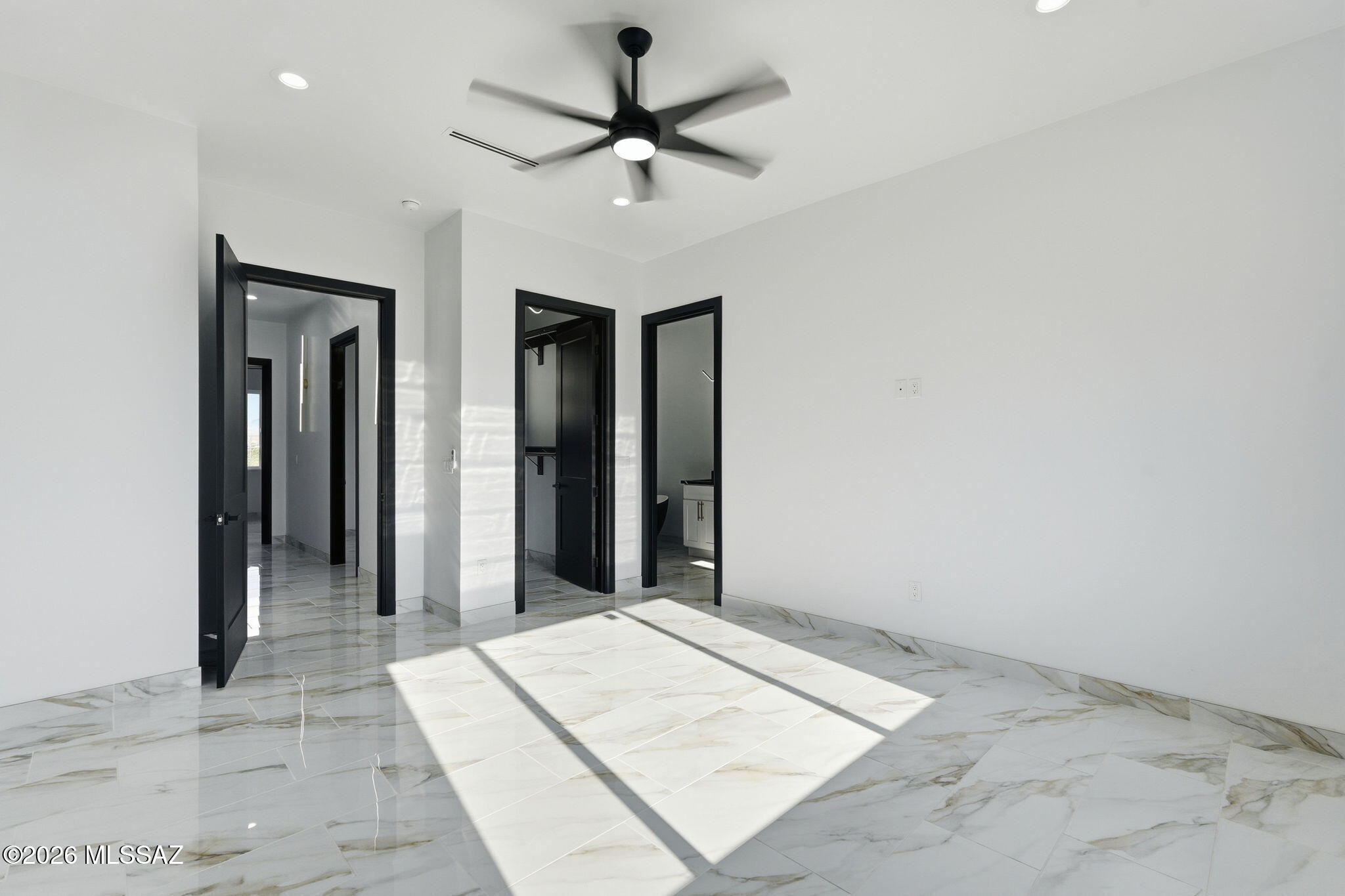 1786 Peralta Court Rio Rico, AZ 85648 - Photo 31 of 50 a view of a hallway with a chandelier fan