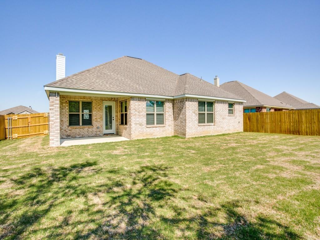 4113 Bridle Path Lane Sanger, TX 76266 - Photo 25 of 25 a front view of a house with a garden