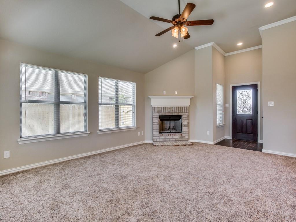 4113 Bridle Path Lane Sanger, TX 76266 - Photo 3 of 25 an empty room with windows and fireplace