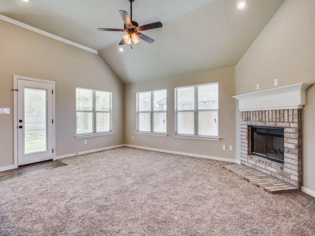 4113 Bridle Path Lane Sanger, TX 76266 - Photo 6 of 25 a view of an empty room with a fireplace and a window