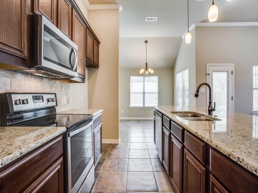 4113 Bridle Path Lane Sanger, TX 76266 - Photo 8 of 25 a kitchen with stainless steel appliances granite countertop a sink stove and cabinets