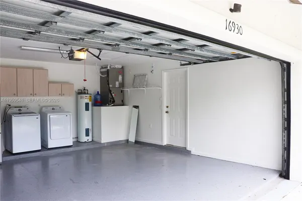 a view of a porch with furniture and garden