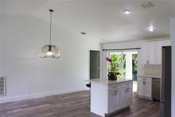 a view of an empty room with a sliding door