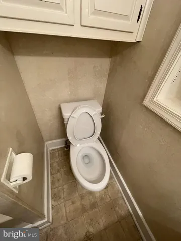 a bathroom with a sink a mirror and a toilet