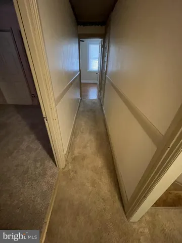 an empty room with staircase