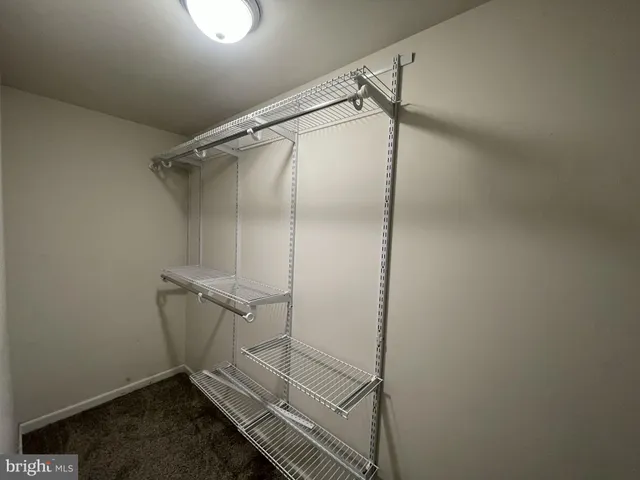 a view of empty room with stairs