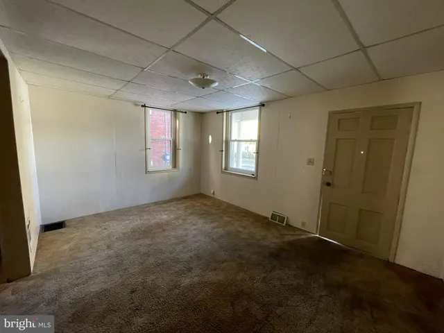 an empty room with windows