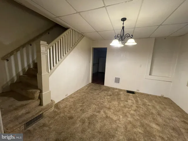 a view of a hallway with a chandelier