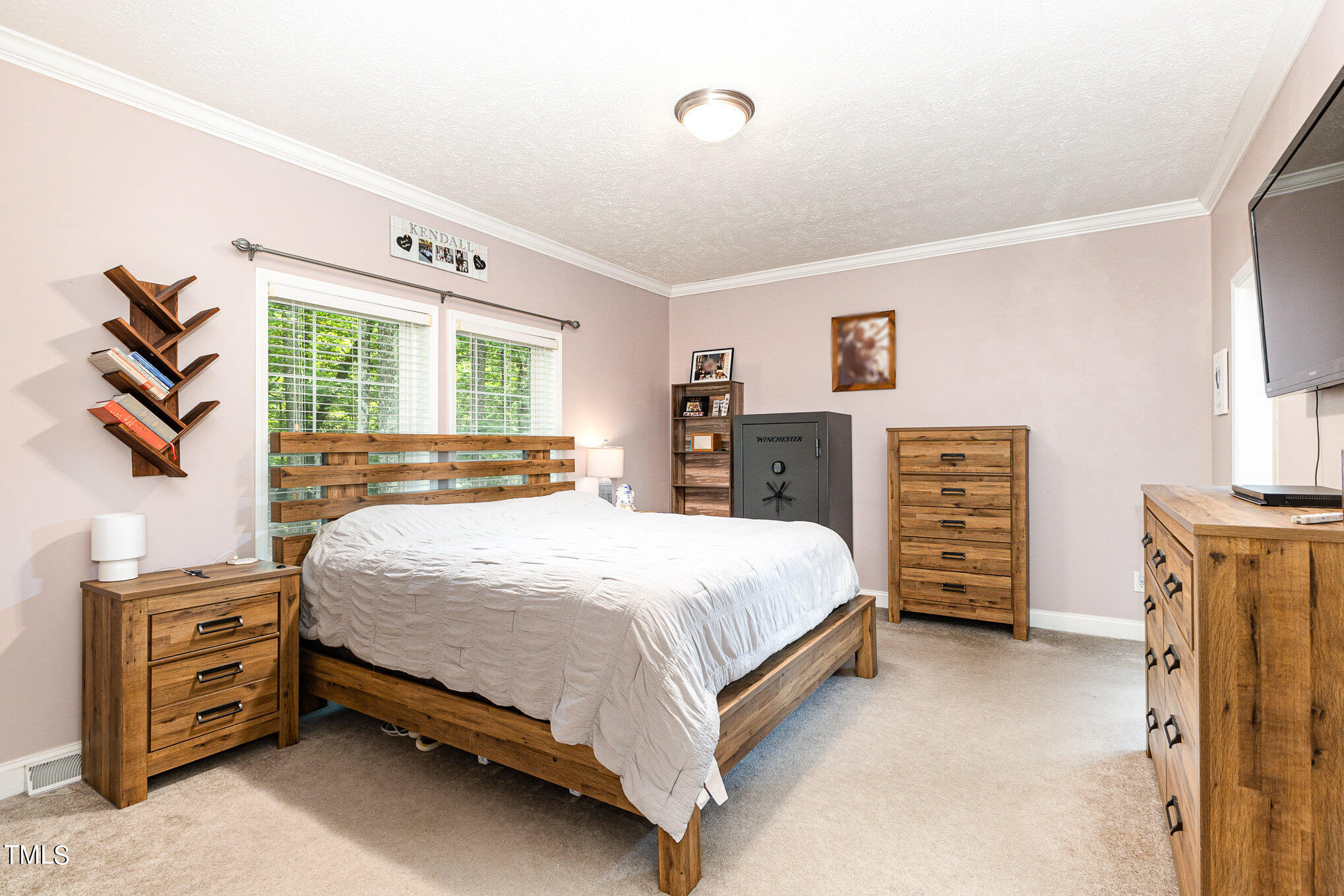 104 Dove Road Creedmoor, NC 27522 - Photo 19 of 25 a bedroom with a bed and dresser