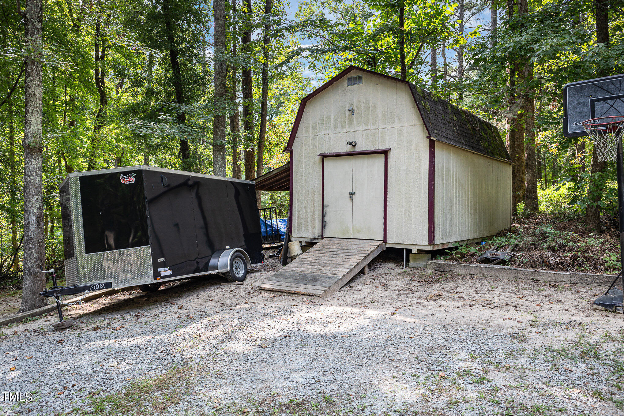 104 Dove Road Creedmoor, NC 27522 - Photo 8 of 25 a view of backyard with a barn and a sink