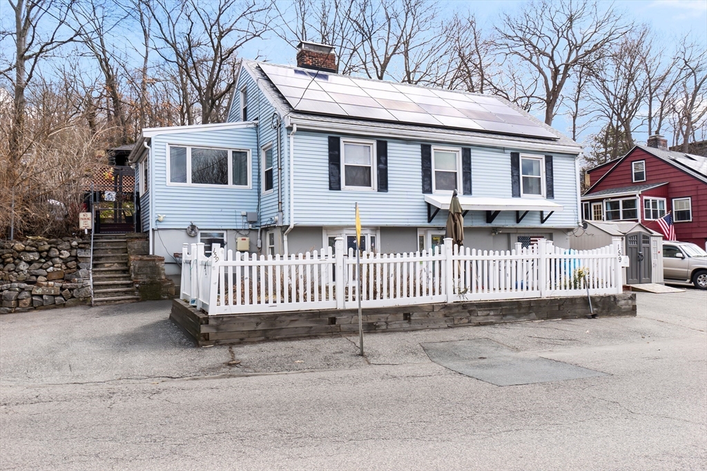 a view of a house with a bed and deck